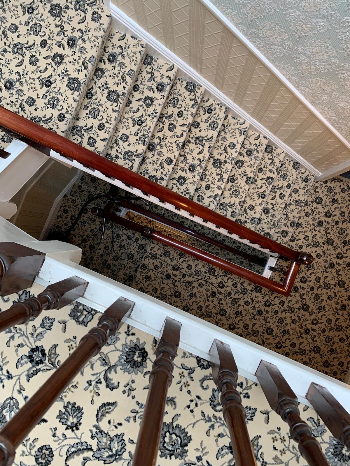 Traditional patterned stair carpet on a period staircase