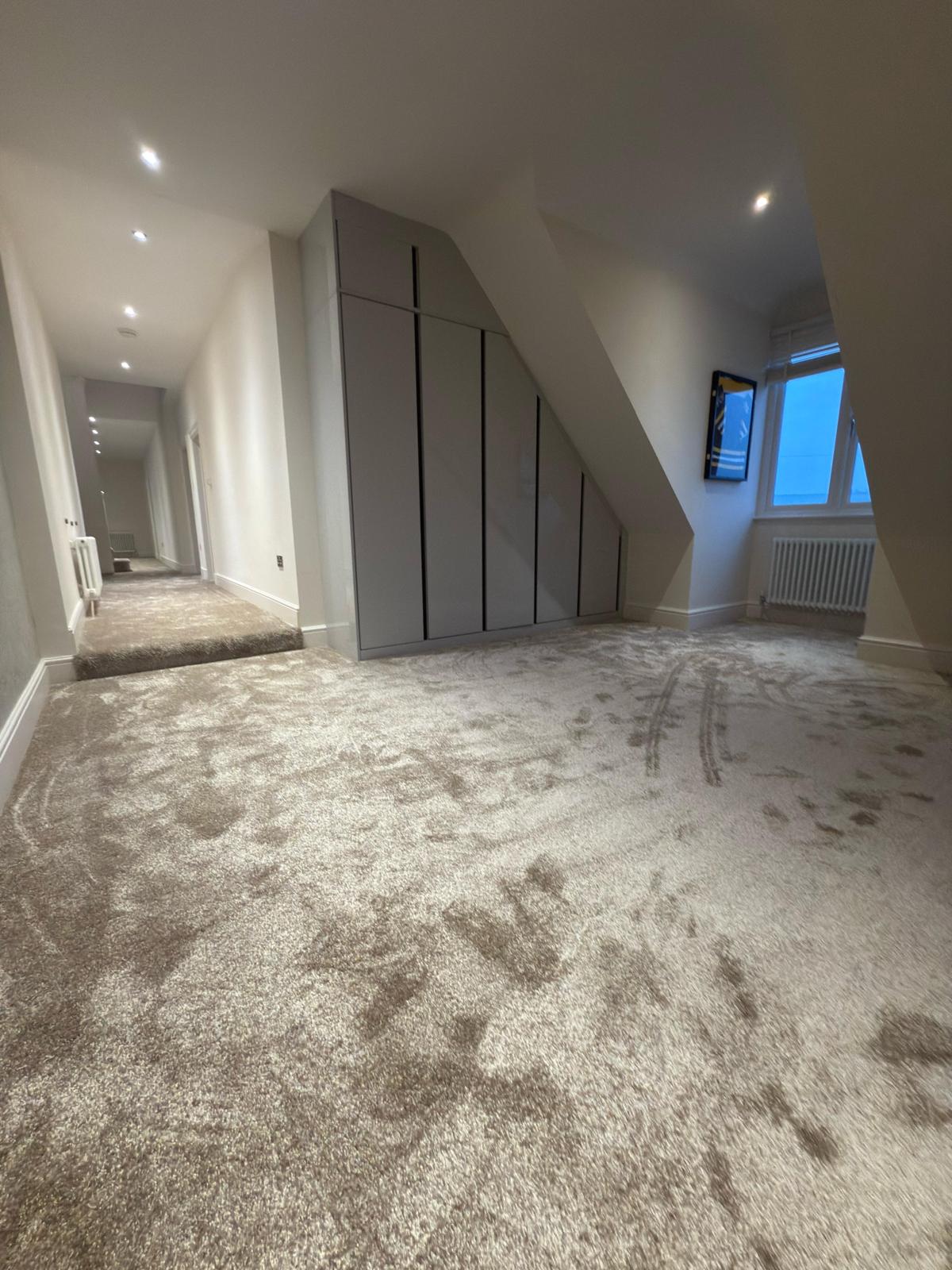 Luxury saxony carpet running through a landing and staircase