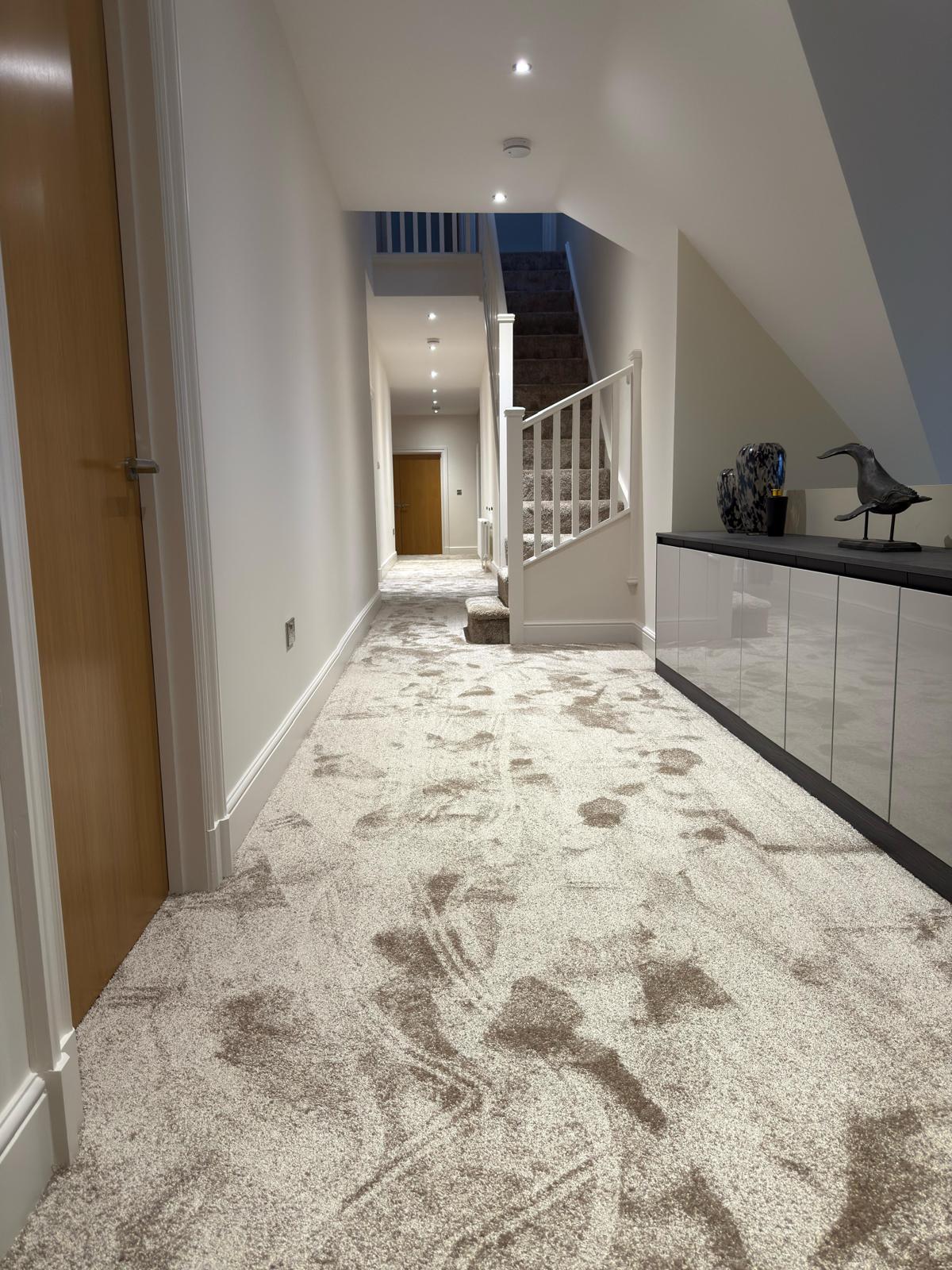 Deep pile champagne carpet in a loft bedroom with fitted wardrobes